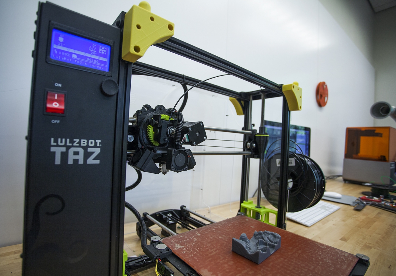 lulzbot 3D printer with small gray topographical model on print bed