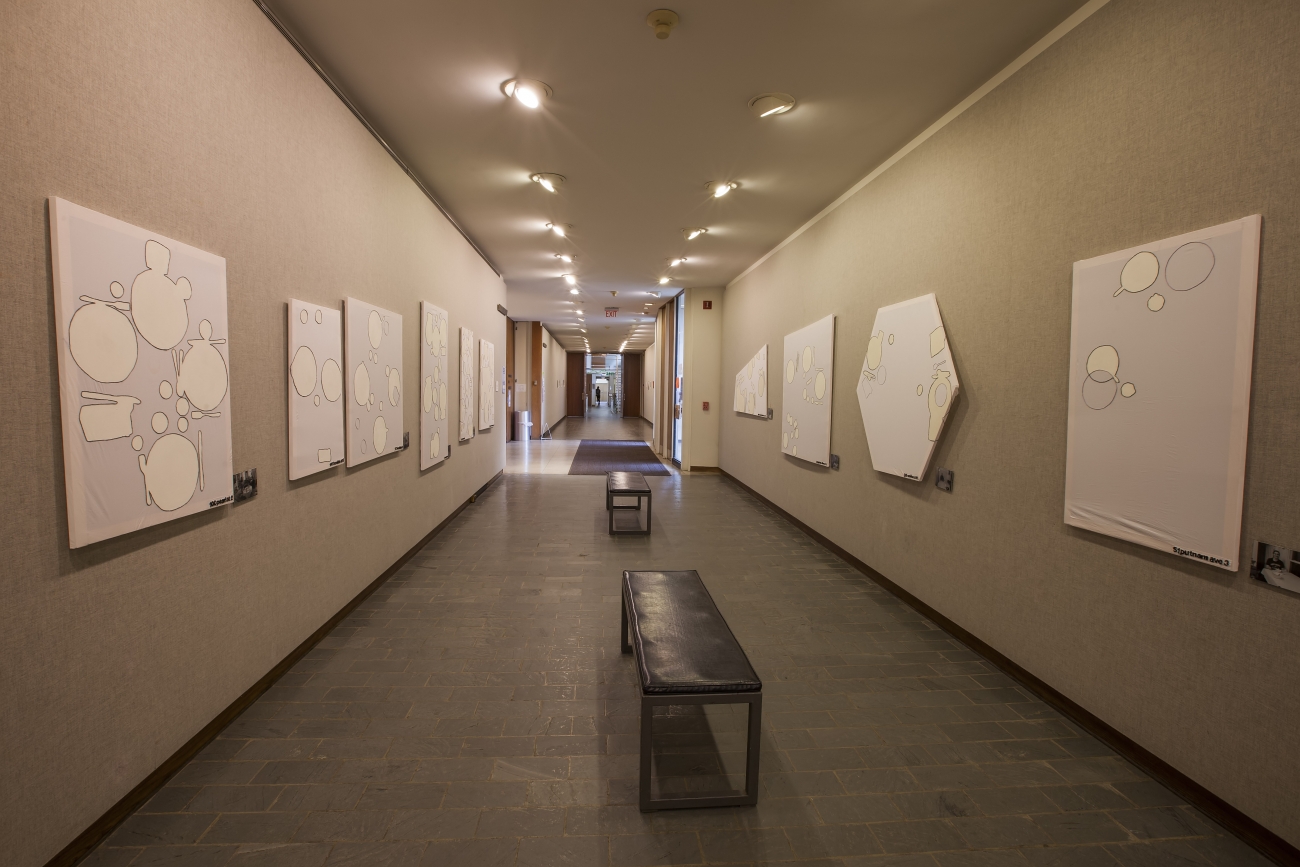 view looking down Jewett hallway with large paintings on both walls
