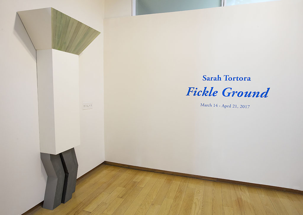 Sculpture by Sarah Tortora with exhibition wall text