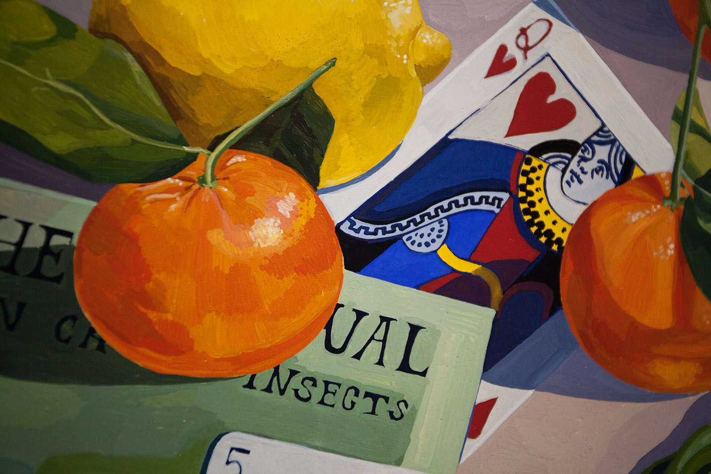 close up on a colorful painting featuring small orange fruit sitting on playing cards