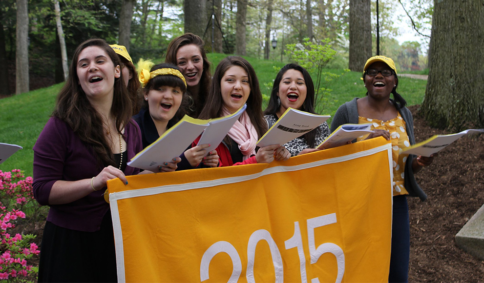 Members of the class of 2015 behind a class banner