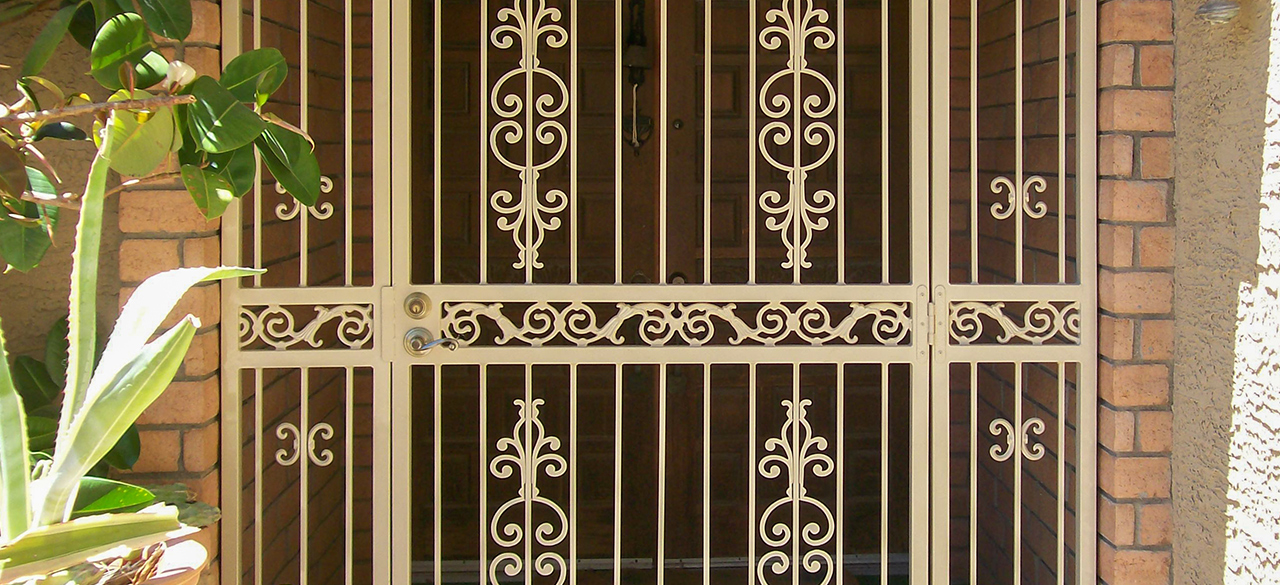 A door with a metal scroll pattern, meant to represent Brenda Peynado ‘05's story "The Great Escape"