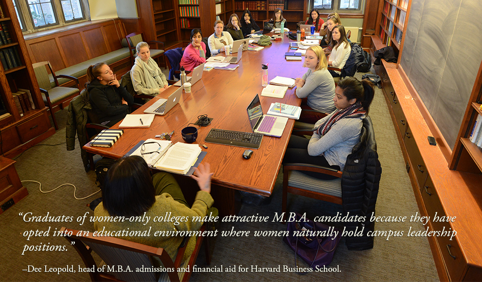 Wellesley students gathered around a classroom conference table. 