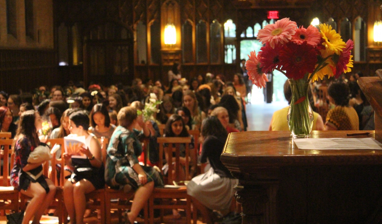 Flowers in the foreground, Houghton Chapel is filled for Flower Sunday
