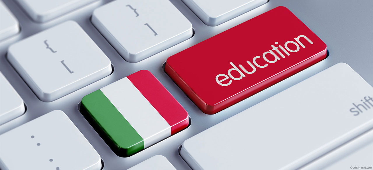 A keyboard with one key that looks like an Italian flag and another that says education