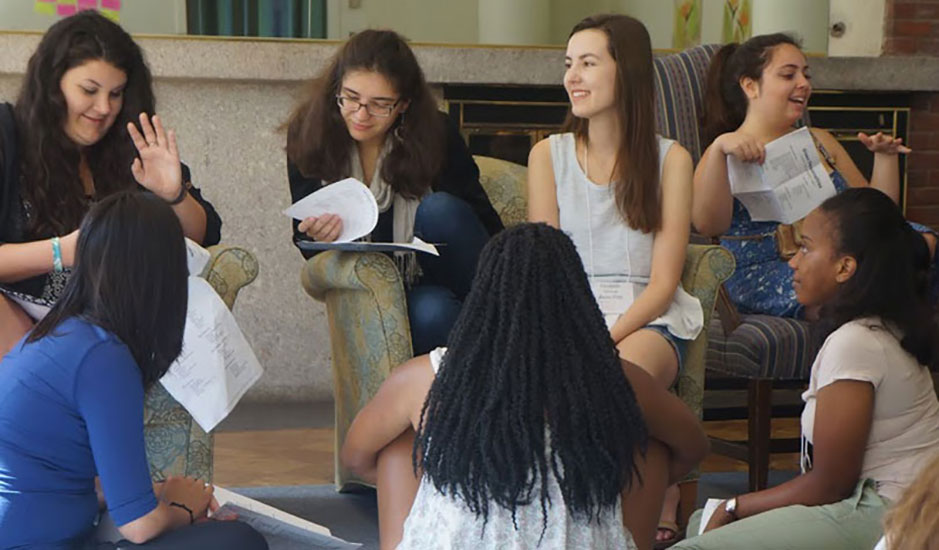 diverse students discuss leadership styles in small group