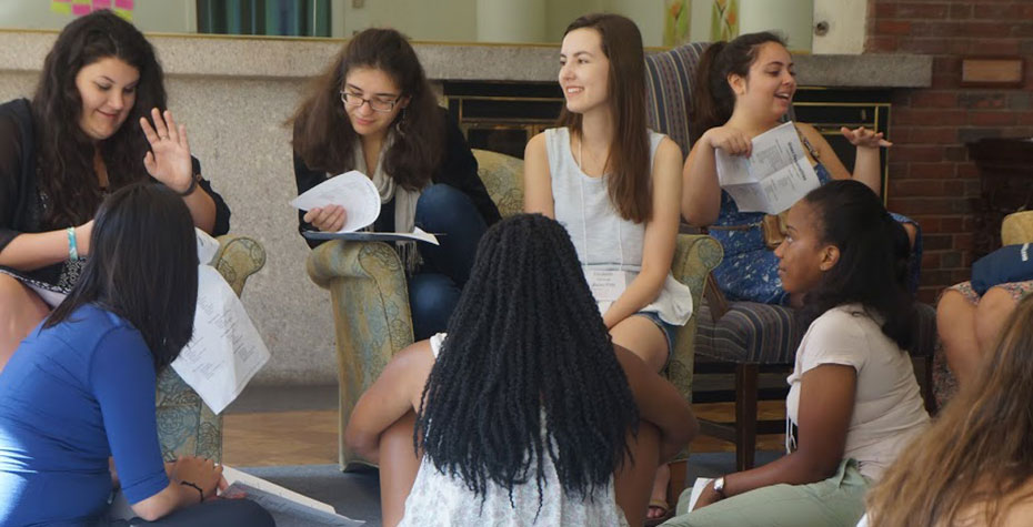 diverse students discuss leadership styles in small group