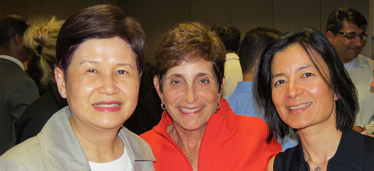 Lois Juliber ’71 (center) with MasterCard Foundation CFO Peggy Woo (left) and Reeta Roy, president and CEO (right).