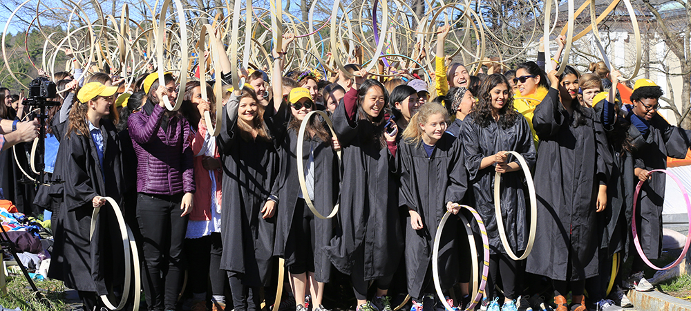 Students holding their hoops, preparing for the hooprolling contest 