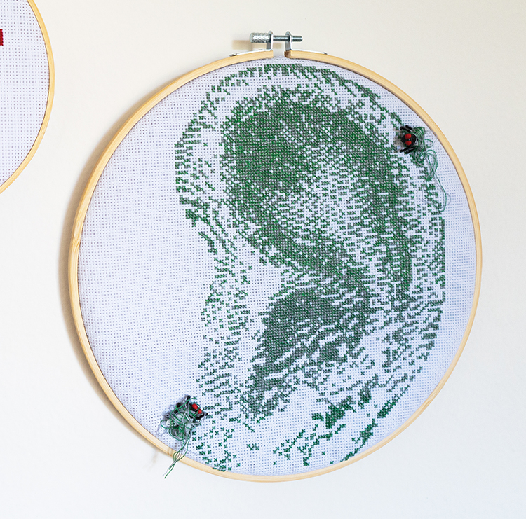embroidery hoop with realistic green ear embroidery design
