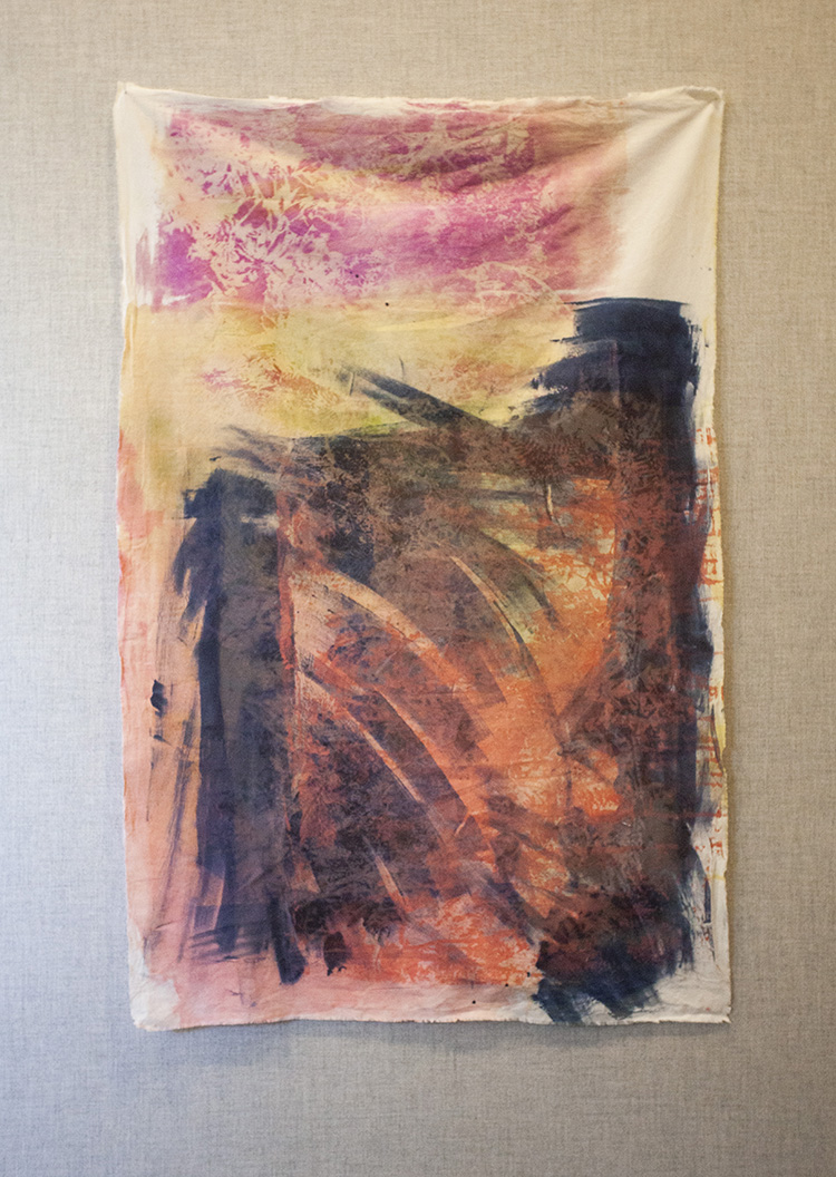 abstract print with botanical forms dyed on fabric in shades of pink, yellow, and blue