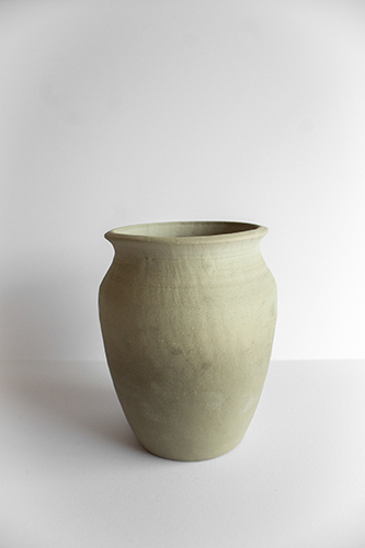 yellowish-gray clay pot with wide mouth