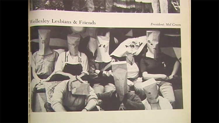 page from a Wellesley Legenda yearbook showing group of people wearing paper bags over their heads with the header Wellesley Lesbians and Friends