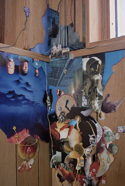 close-up of collage on wood paneled corner