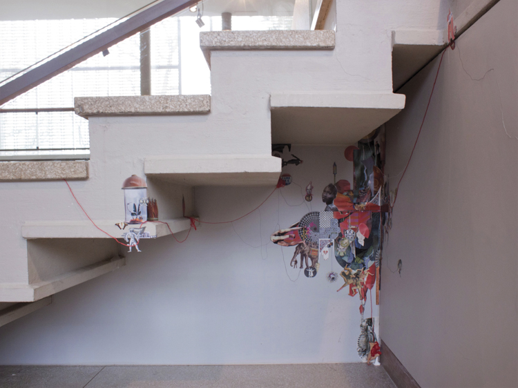 collage tucked into space beneath staircase