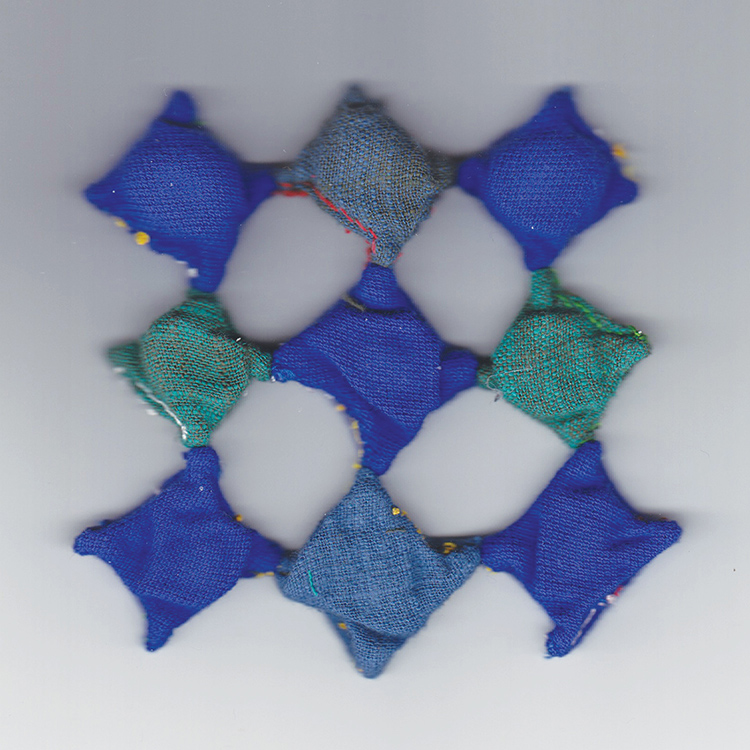 square of 9 fabric diamonds in shades of blue and teal