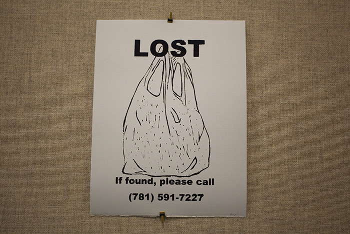 single bluish LOST poster on a grayish wall with a line drawing of a plastic bag
