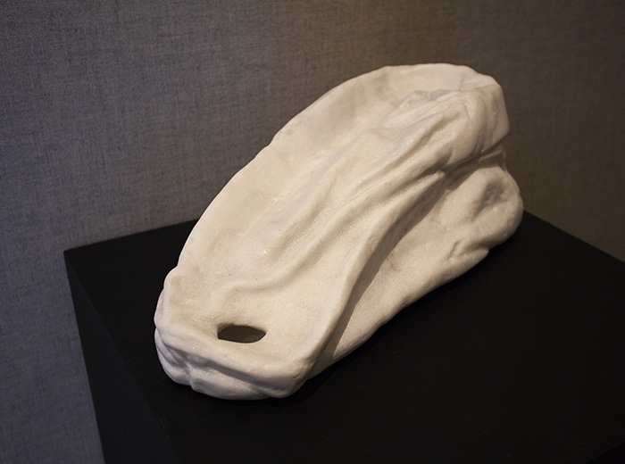 white marble sculpture of a plastic bag