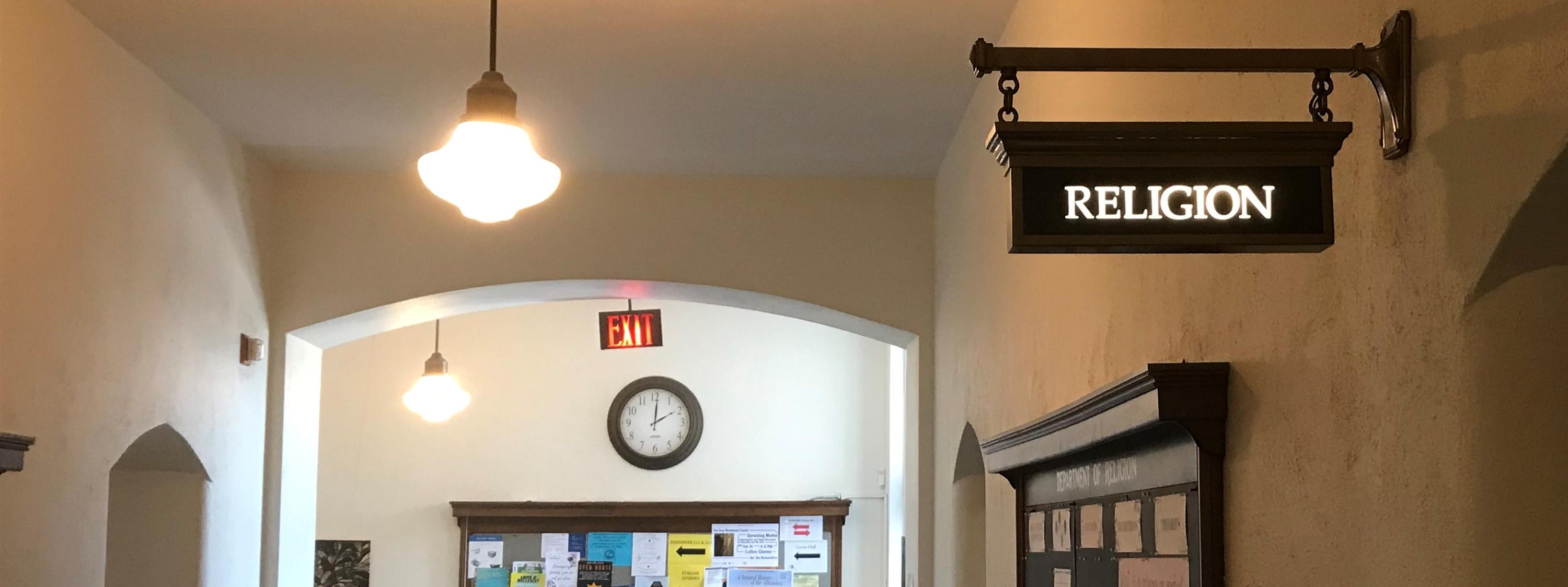 Religion Department sign and hallway in Founders Hall